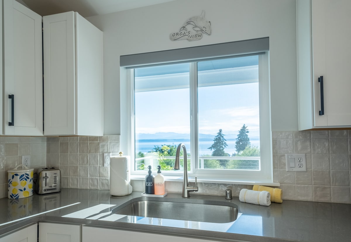 Kitchen sink with water and mountain views