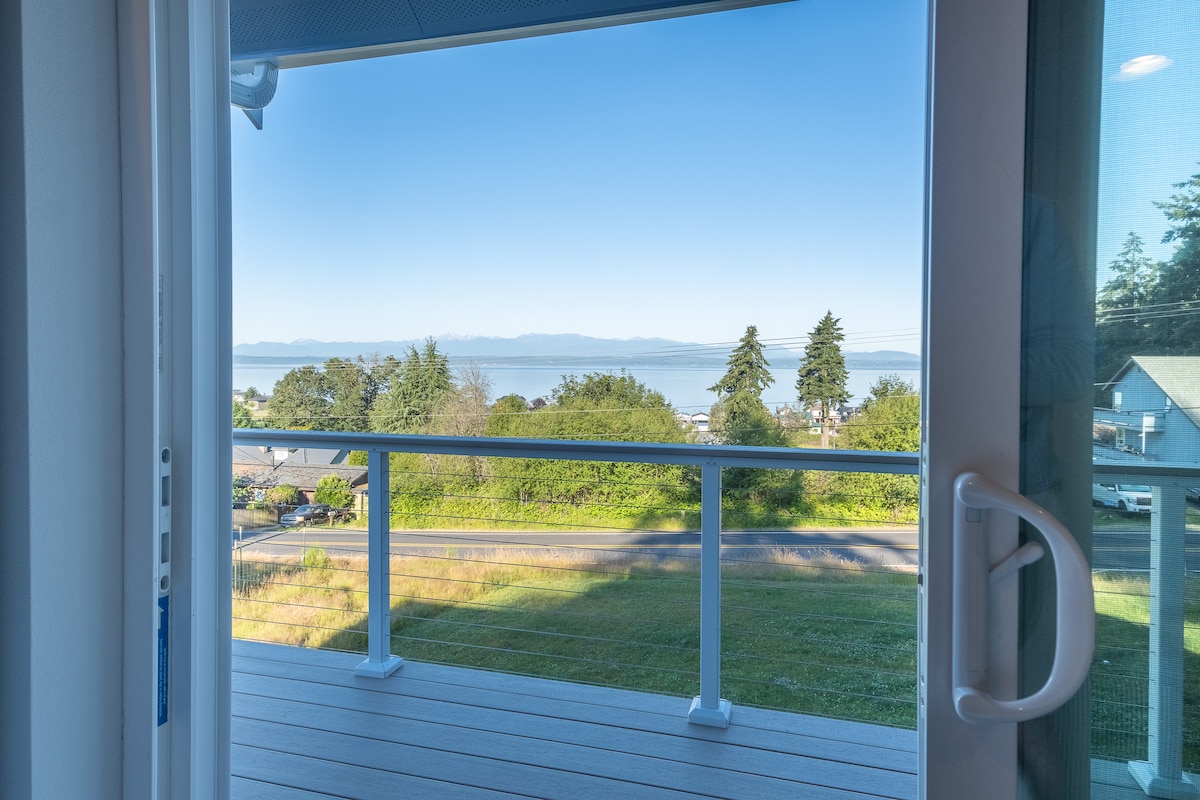 Deck doors opening to water and mountain views